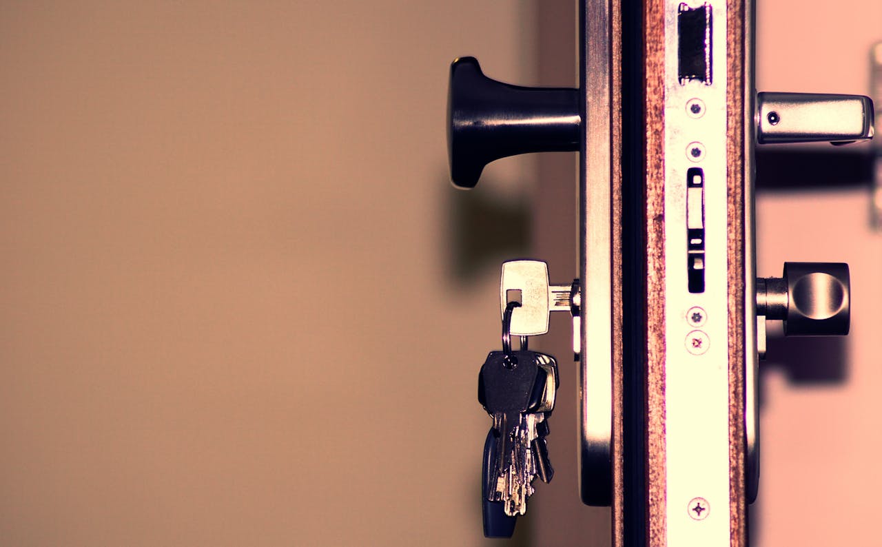 portfolio-02 Detailed view of a door lock and keys emphasizing security and access.